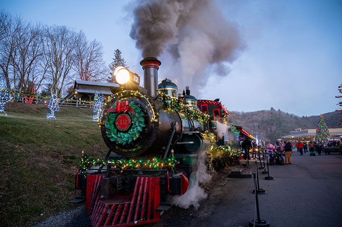 steam engine blowing smoke into the sky at Tweesie railroad