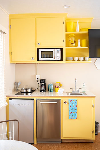 yellow kitchenette in a quaint 1950s era roadside motel. 